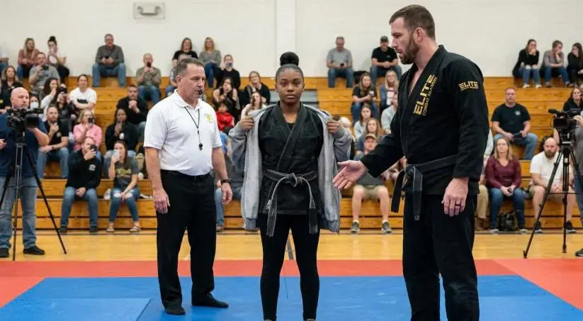 Black Belt Sneers Too Small to Fight at Black Girl — His Hand Shakes as She Removes Her Jacket